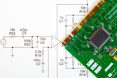 circuit board lying on a schematic diagram